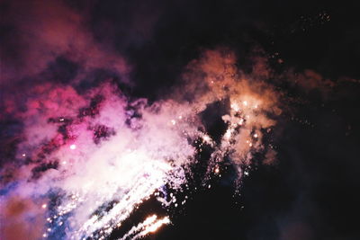 View of firework display at night