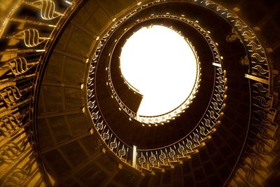 Low angle view of spiral staircase in building