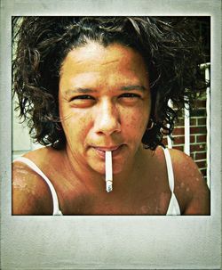 Close-up portrait of man smoking cigarette