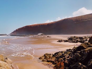 Scenic view of beach against sky