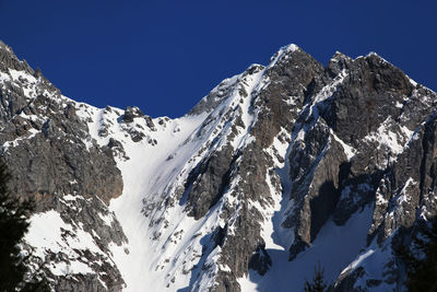 Scenic view of snow covered mountains