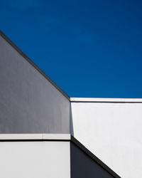 Low angle view of building against clear blue sky