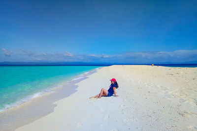 Full length of man on beach against sky