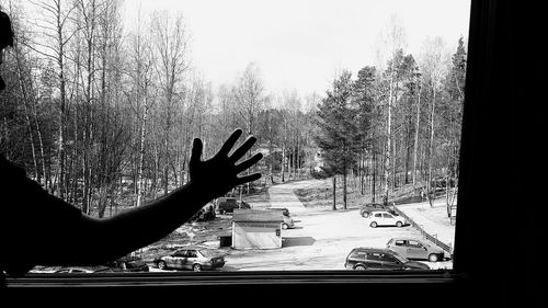 Silhouette man on window