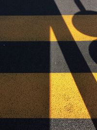 Yellow shadow on road