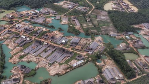 High angle view of buildings and river in city