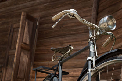 Close-up of bicycle on wood