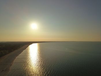 Scenic view of sea against clear sky during sunset