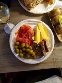 High angle view of fruits in plate on table
