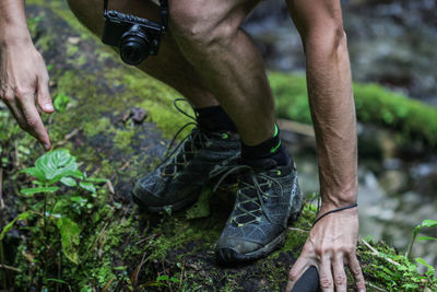 Low section of man hiking in forest