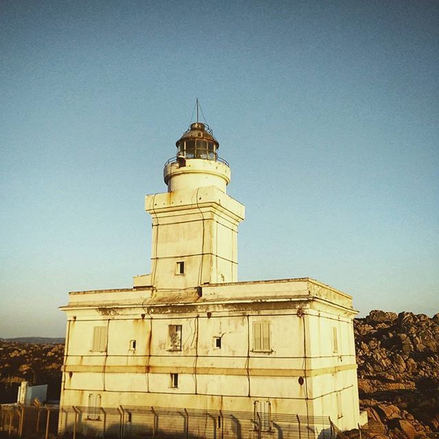 architecture, building exterior, built structure, clear sky, copy space, blue, tower, dome, low angle view, place of worship, religion, travel destinations, church, lighthouse, famous place, history, spirituality, day, tourism