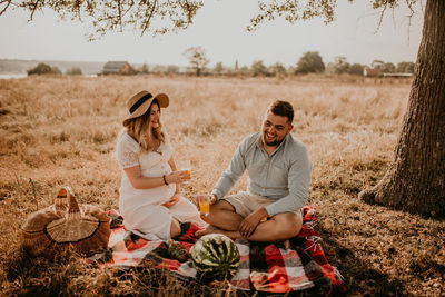 Friends sitting on field
