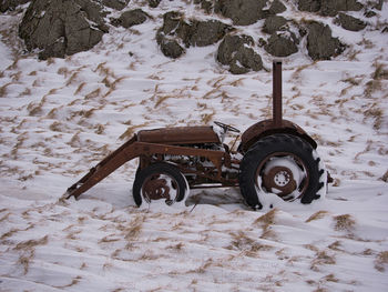 High angle view of snow covered land on field