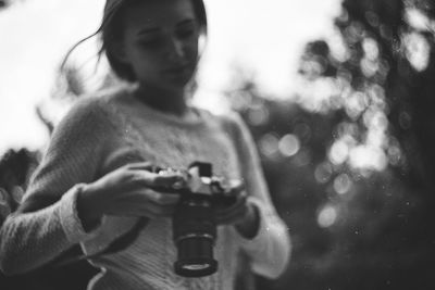 Close-up of man holding camera