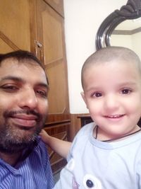 Portrait of smiling boy at home