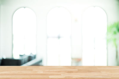 Close-up of empty table against wall