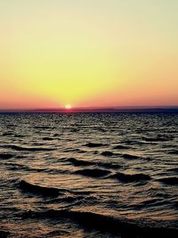 Scenic view of sea against clear sky during sunset