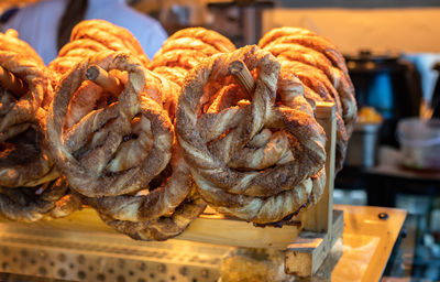 Close up of puff pastry pretzels with brown sugar and cinnamon in small bakery store small business