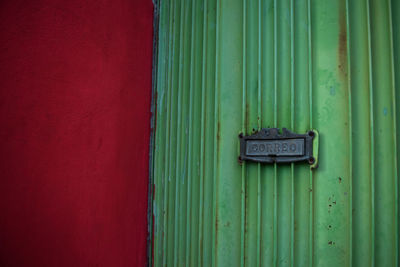 Red and green letter box in spanish language correo

