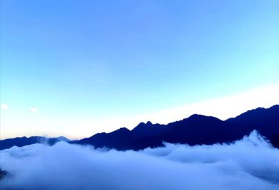 Scenic view of mountains against sky during sunset