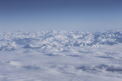 Scenic view of snowcapped mountains against sky