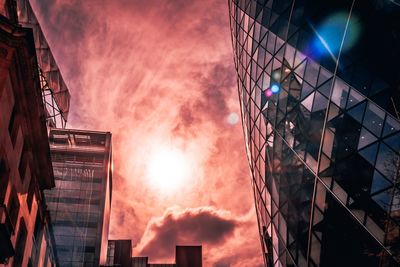 Low angle view of buildings against sky during sunset