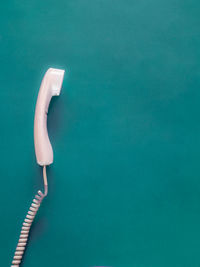 High angle view of white table against blue background