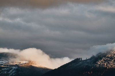 Scenic view of mountains against sky during winter