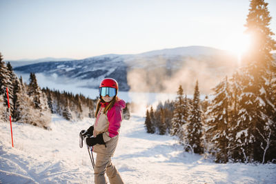 View of girl on ski slope