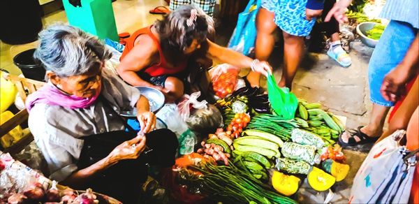 High angle view of people enjoying in market