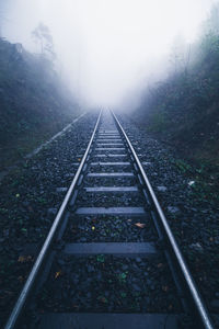 Railroad tracks in foggy weather