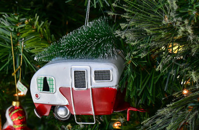 Close-up of christmas ornaments hanging on the christmas tree