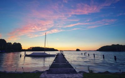 Scenic view of silhouette trees against sky at sunset
