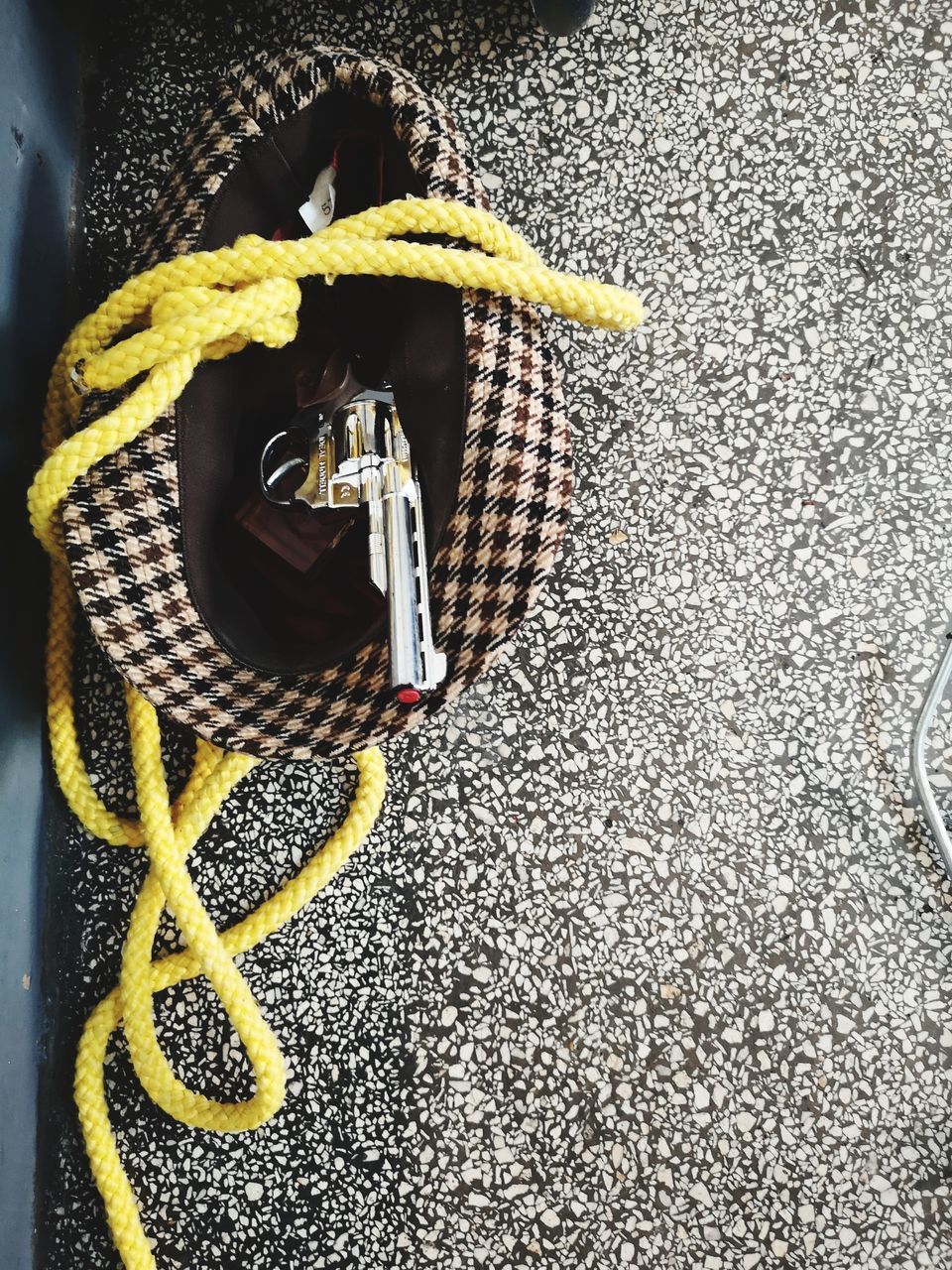 HIGH ANGLE VIEW OF SHOES TIED UP ON ROPE