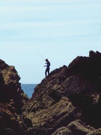 Man standing on cliff