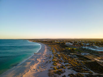 Scenic view of sea against clear sky during sunset