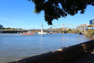 View of river in city against sky