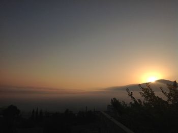 Scenic view of silhouette landscape against sky during sunset