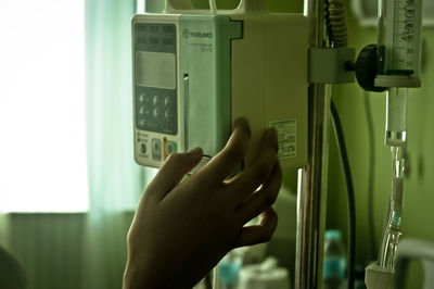 Cropped image of woman holding smart phone