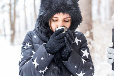 Portrait of woman in snow