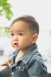 Portrait of cute boy looking away