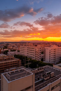 High angle view of cityscape against sky during sunset