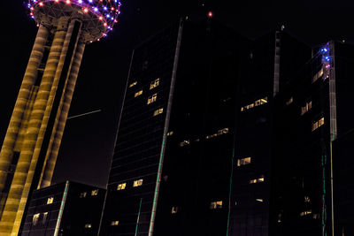 Low angle view of illuminated building at night