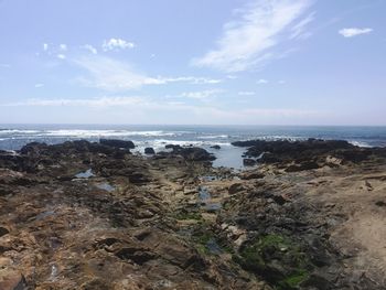 Scenic view of beach and sea against sky