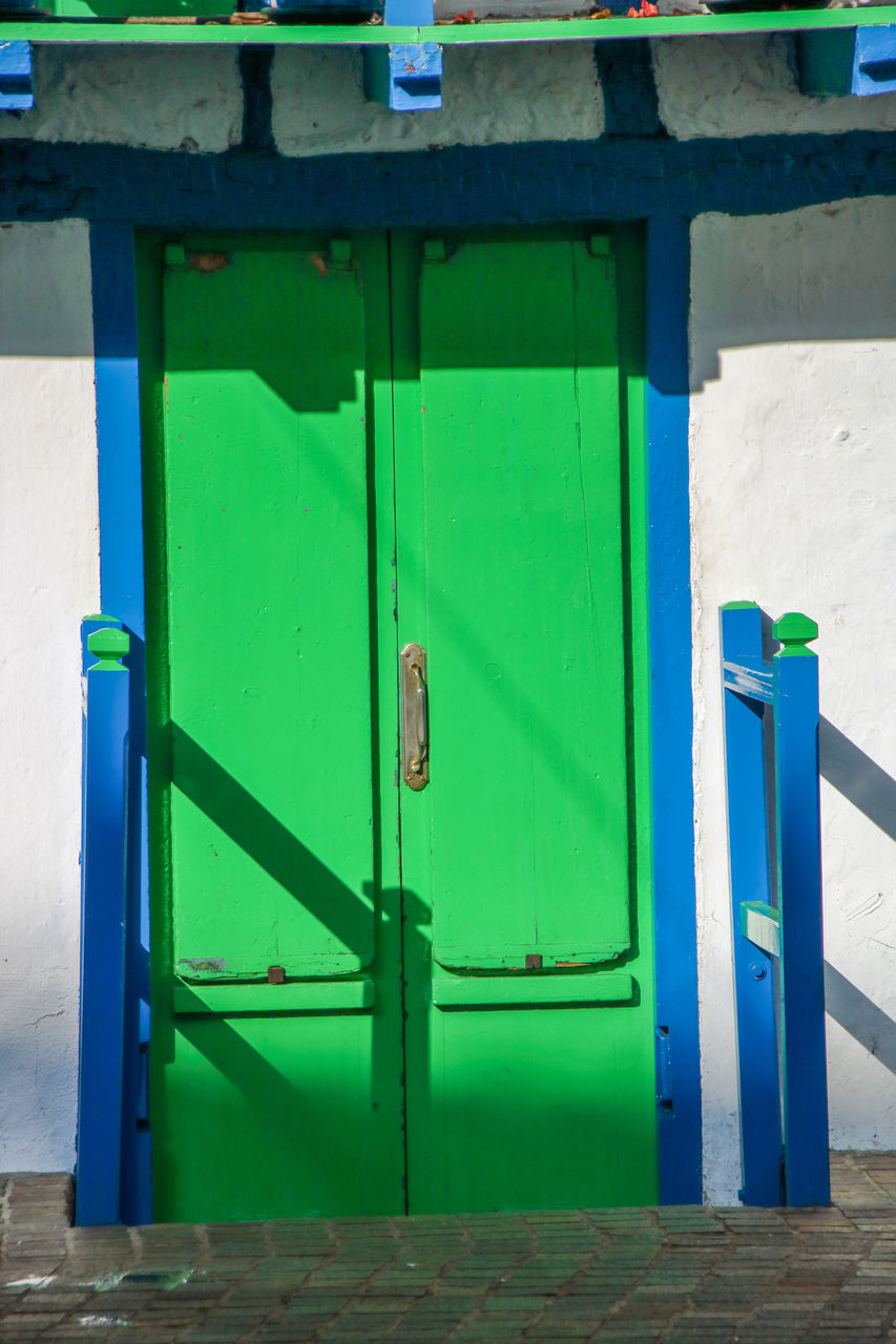 CLOSED DOOR OF BLUE BUILDING