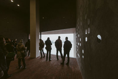 Group of people standing in art museum