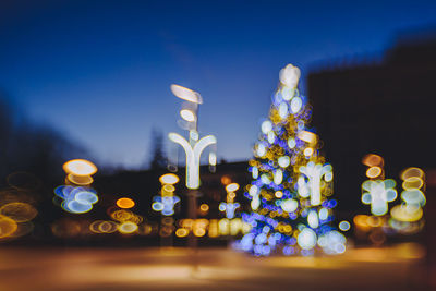 Close-up of illuminated christmas lights at night