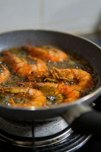 Close-up of meat in cooking pan