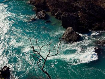 High angle view of rocks in sea