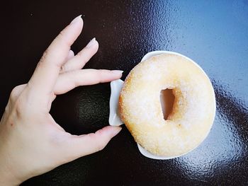 Midsection of person holding ice cream